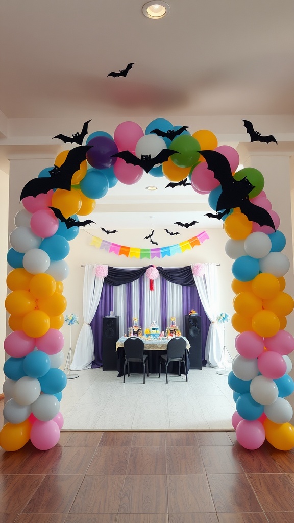 A vibrant balloon arch decorated with colorful balloons and black bat shapes, leading to a festive baby shower setup.