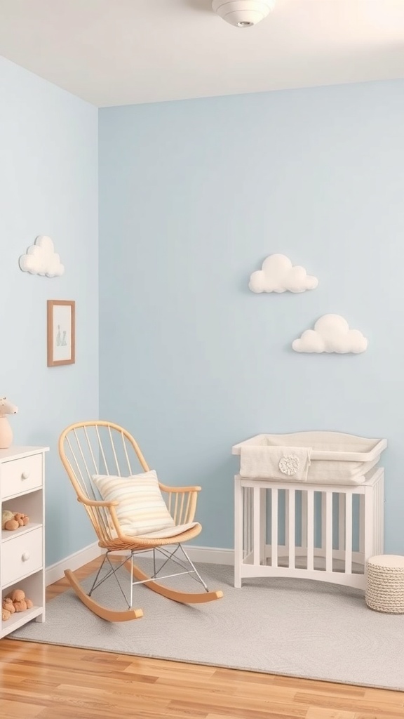 A nursery painted in gentle sky blue with a rocking chair, crib, and cloud decorations.