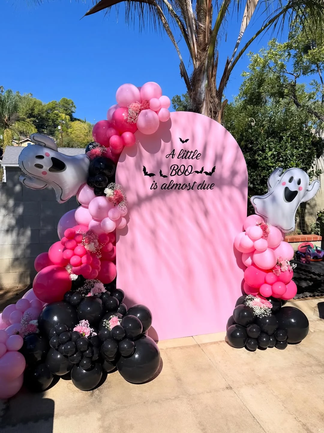 Staircase baby shower decor with balloons and ghost accents