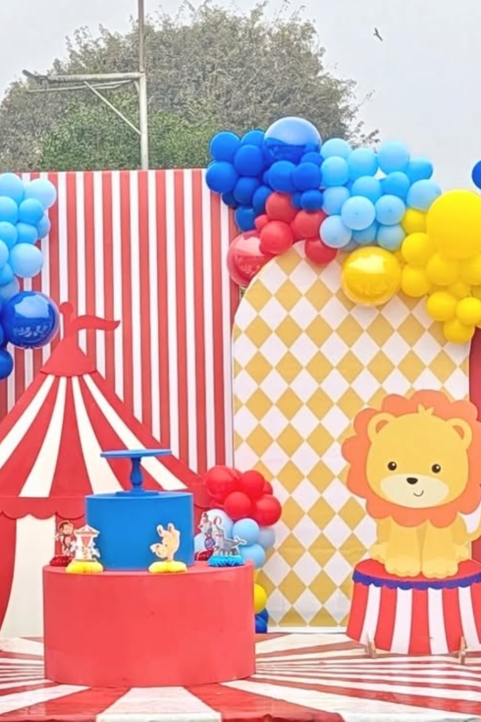 Colorful circus birthday backdrop with balloons and lion decoration