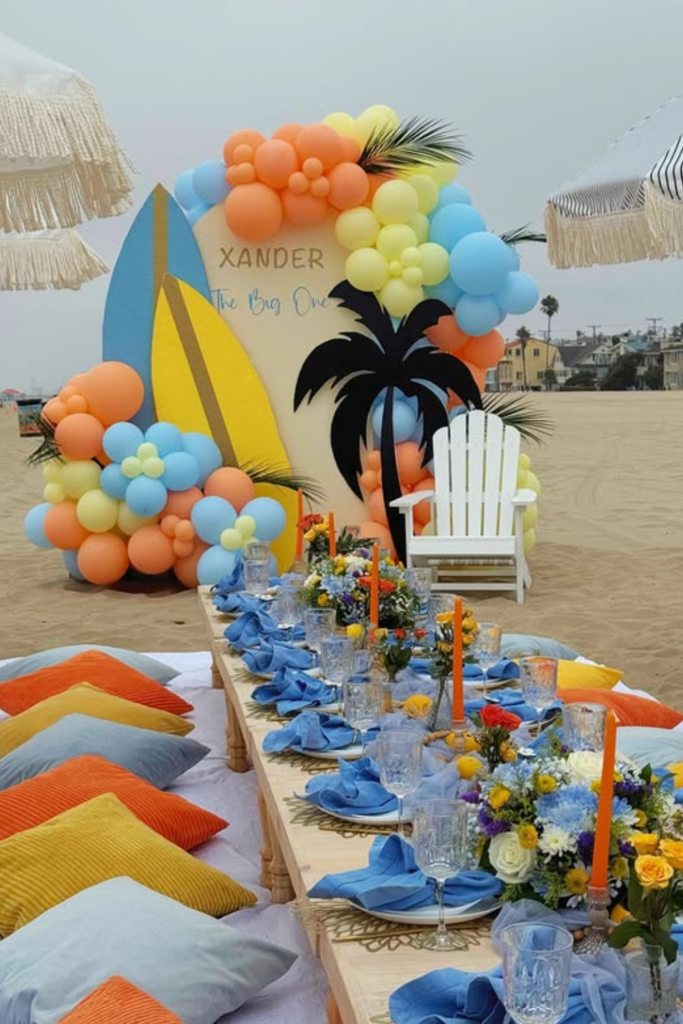 Beach birthday party setup with surfboard and palm tree decorations