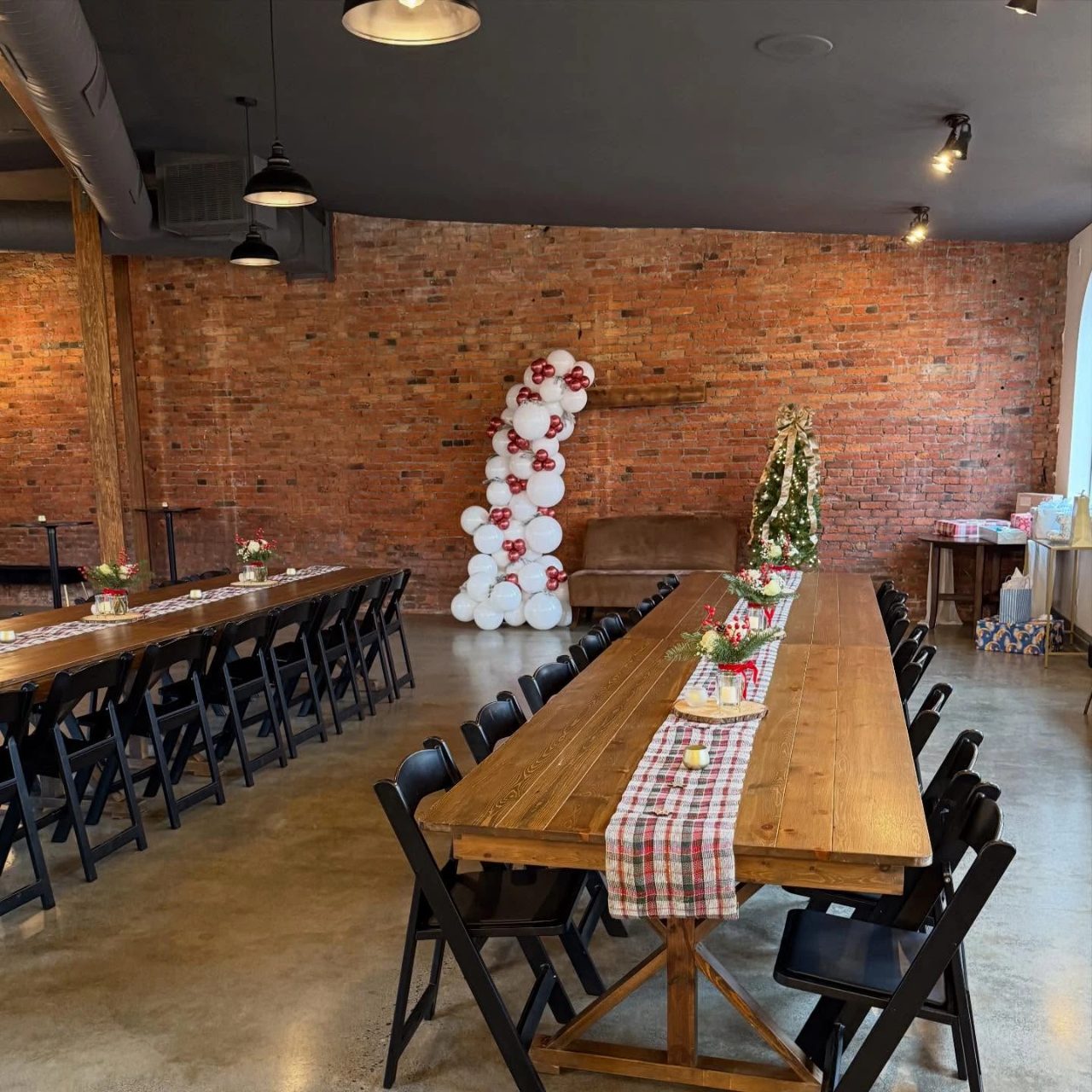 Burgundy ribbon backdrop and floor decor for a merry little baby shower